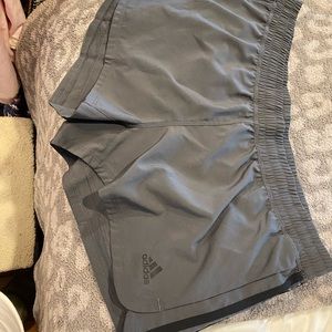 grey and black adidas running shorts